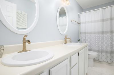 Bathroom with dual-vanity sinks and working plumbing