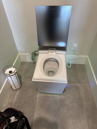 Modern bathroom with Kohler dual-vanity sinks and glass shower installed by Mr Perfect Plumbing