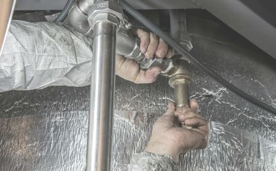 Mr Perfect Plumbing conducting drain services in an Aurora home