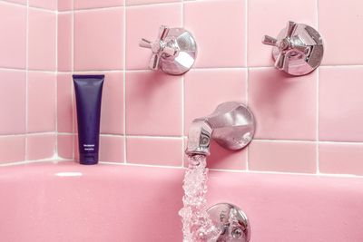 Pink bathroom in Centennial with plumbing serviced by Mr Perfect Plumbing