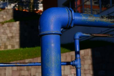 Exterior blue water supply pipes with elbow joints on a property in Cherry Creek, Denver