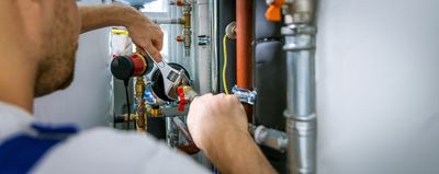 Mr Perfect Plumbing installing a water heater in a Cherry Hills Village home