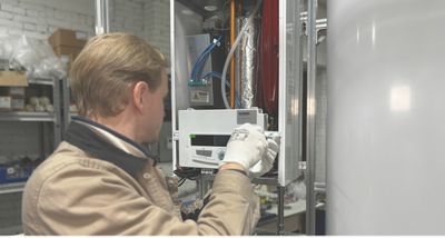 Mr Perfect Plumbing technician fixing a water heater