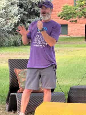 Mr Perfect Plumbing staff speaking into microphone at event